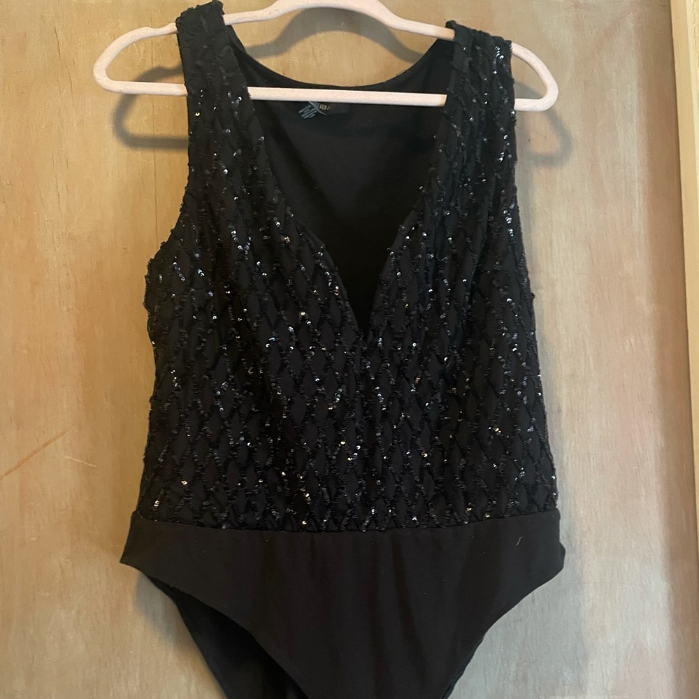 Get ready to sparkle with this body suit